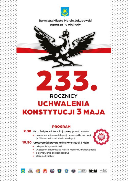 Na białym tle czarny orzeł w koronie. Za nim flaga biało-czerwona. Po obu stronach ramka w małe, czarne kropki